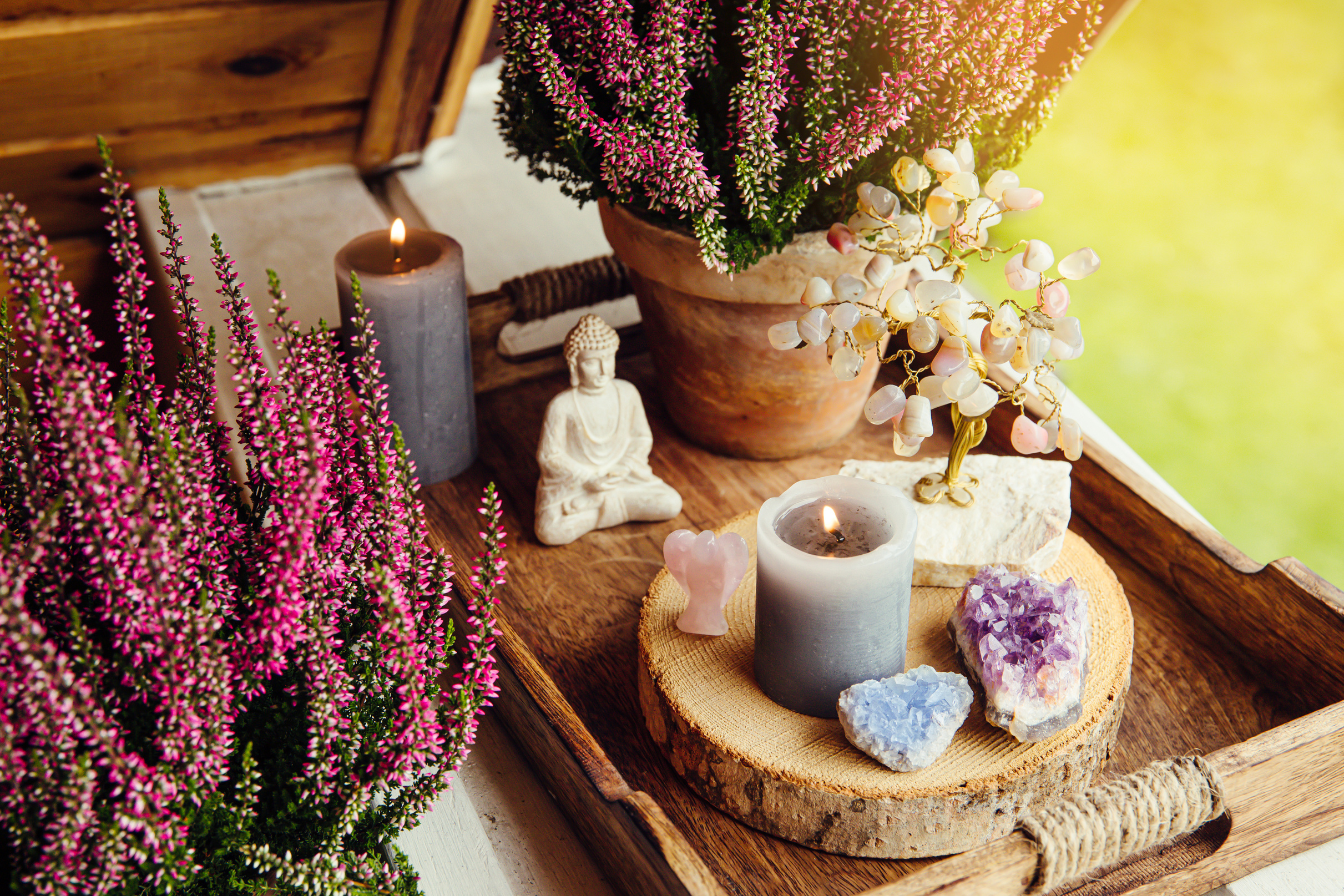 Spiritual home balcony decor with heather flowers, candles.